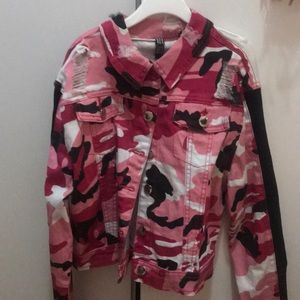 A pink camo Jean jack with rips
